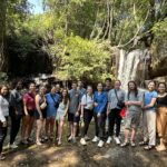 Herbert students pictured in front of a waterfall in Cambodia.
